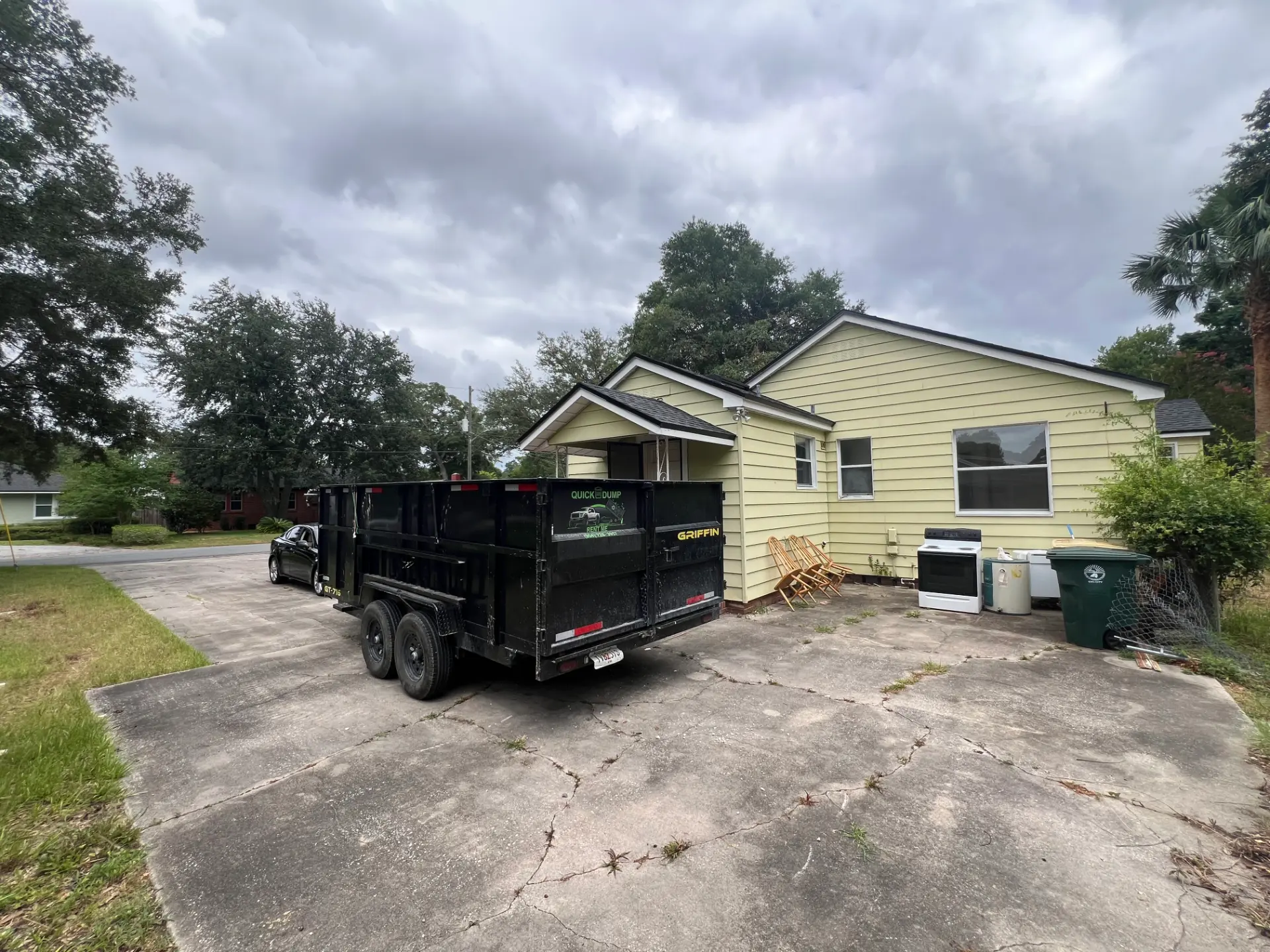Dump trailer staged for a full property cleanout